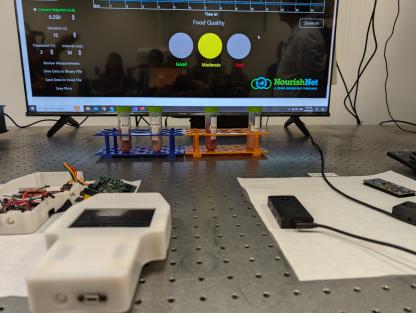 The quantum nose technology hardware, and software displayed on a screen